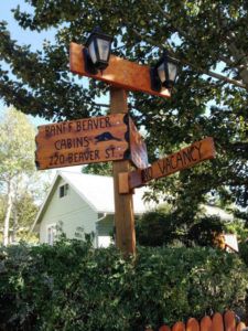 Main Sign next to Banff Beaver Cabins